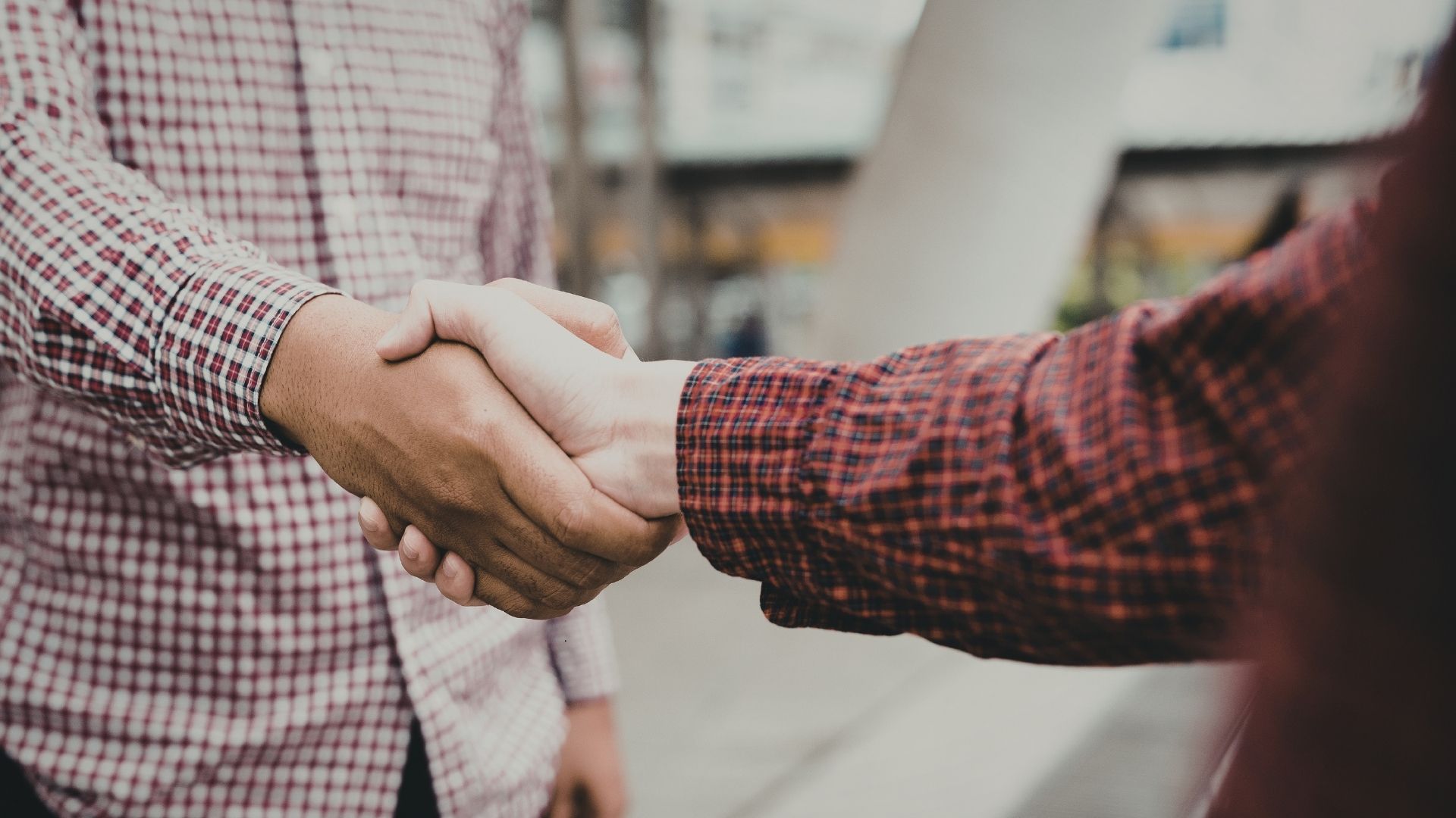 accountant shaking hands with business owner