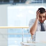 man stressing over BAS error