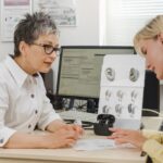 Audiologist working with a patient