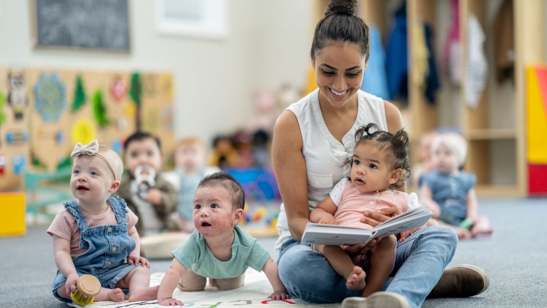 childcare worker engaging with children