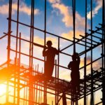 builders on top of a scaffolding after a long day