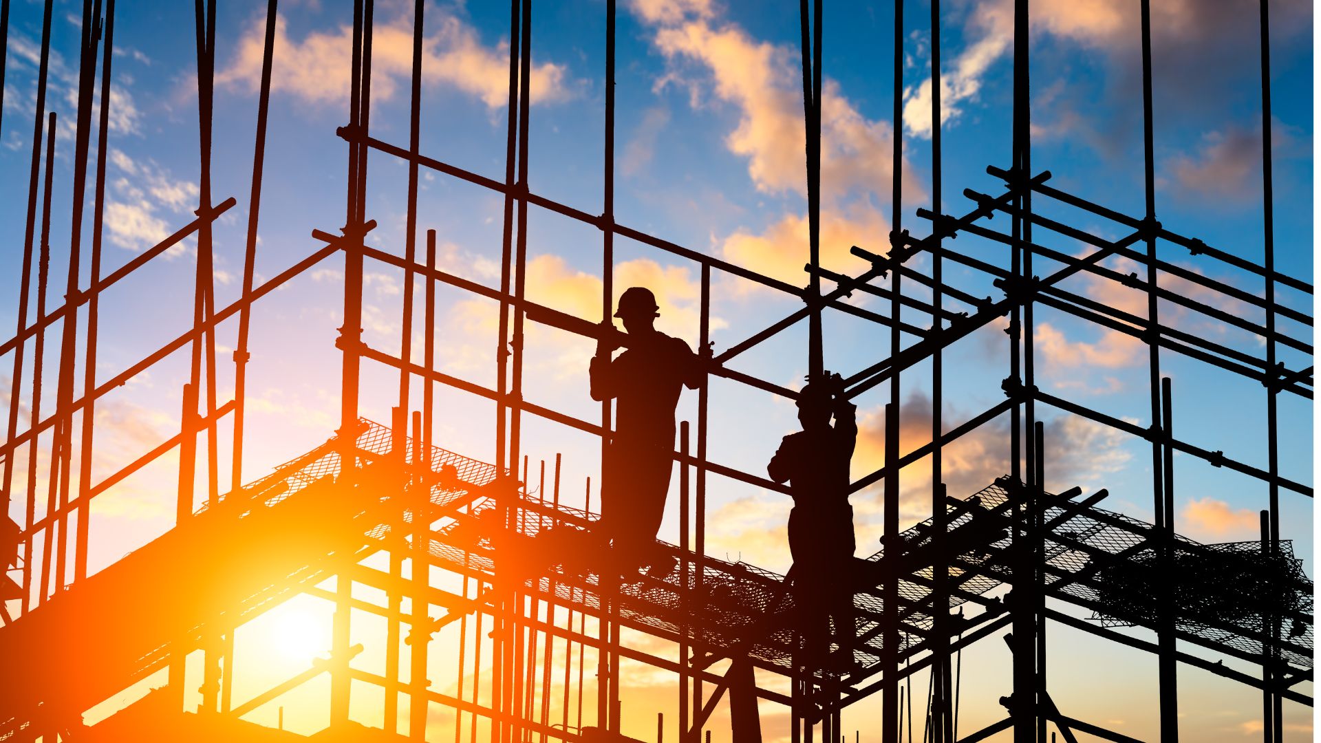builders on top of a scaffolding after a long day