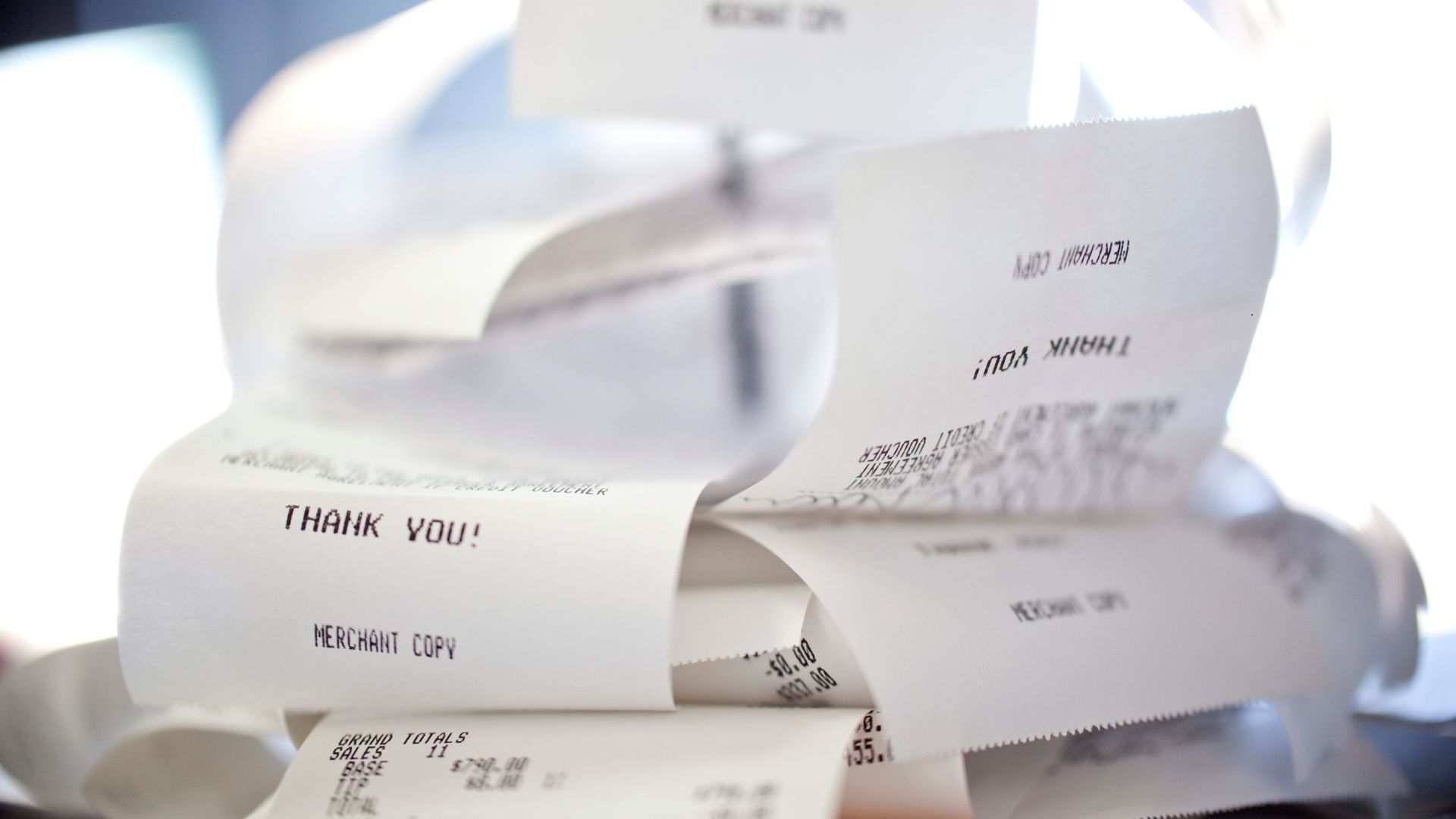 pile of receipts showing a common challenge among mechanics