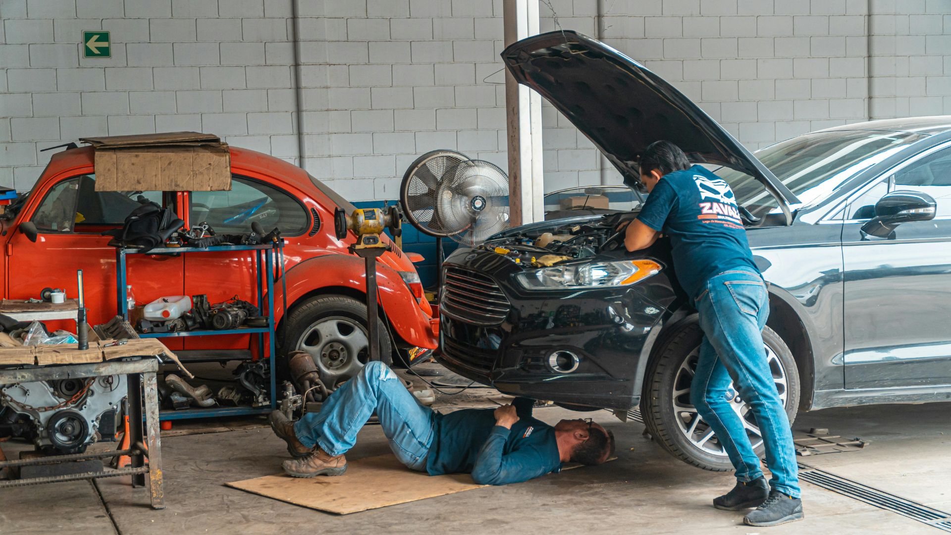 mechanics under the hood of a car